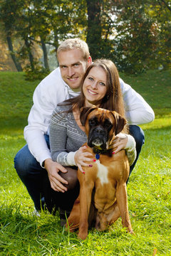 happy young couple with dog