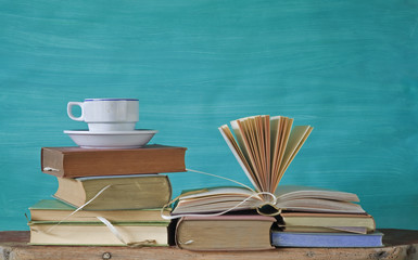 stack of vintage books, coffee cup, free copy space