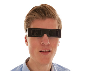 Guy looking through eclipse glasses