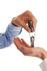 Two hands handing over keys - 57272699