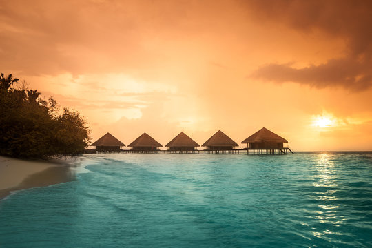 Over water bungalows with steps into amazing green lagoon