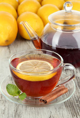 Cup of tea with lemon on table close-up