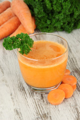 Fresh carrot juice on table close-up