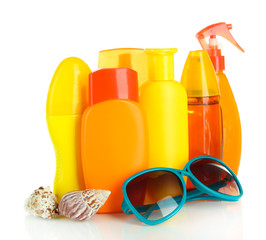 Bottles with suntan cream and sunglasses isolated on white