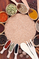 Various spices and herbs with empty board