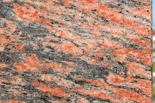 Processed red marble with black streaks
