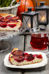 Plum pie in autumn party setting