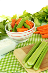 Fresh green celery with vegetables on table close-up