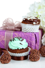 Tasty cupcake with gifts close up