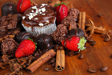 Tasty cupcake with different sweets close up