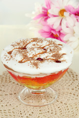 Tasty jelly in bowl on table on light background
