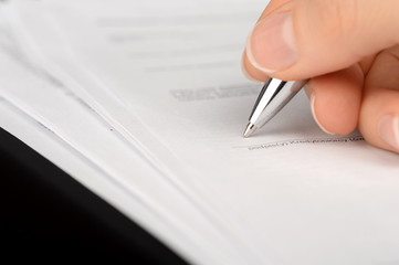 Hand signing a bank account contract
