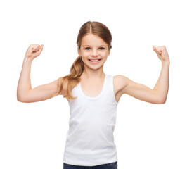 teenage girl in blank white shirt showing muscles