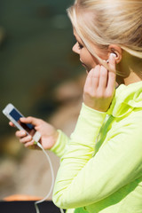 woman listening to music outdoors