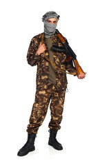 Arab nationality in camouflage suit and keffiyeh with automatic