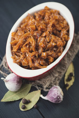 Bowl with stewed cabbage and spices, view from above