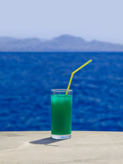 Cocktail on marble table at beach