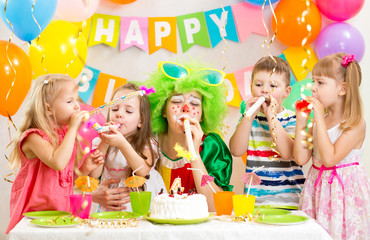 kids and clown at birthday party