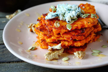 Pumpkin pancakes with honey and blue cheese