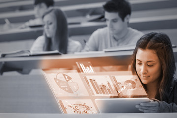 Cute student in university working on her digital tablet