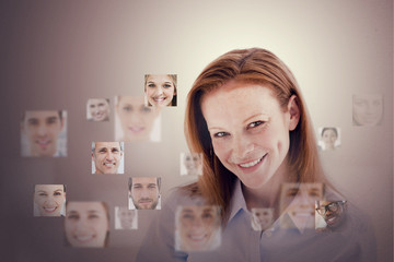 Smiling businesswoman encircled by digital interface
