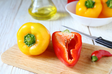 fresh pepper on chopping board and knife