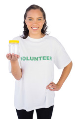 Volunteer woman showing jar