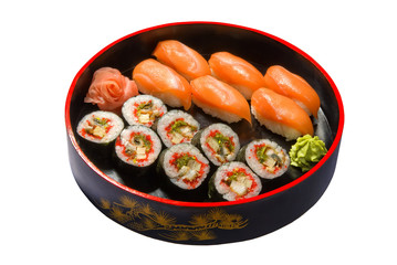 nigiri sushi set in a round wooden plate