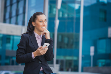businesswoman, on the modern building background © Dmytro Titov