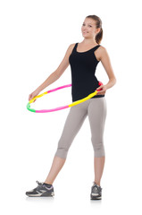 Fototapeta na wymiar Woman doing exercises with hula hoop