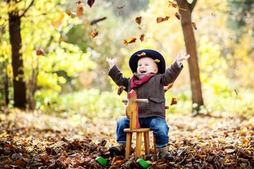 little boy in the autumn forest