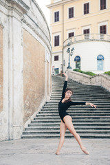 Fototapeta na wymiar Young beautiful ballerina dancing on the Spanish Steps in Rome,