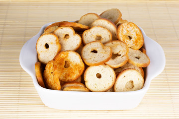 small round mini bake rolls in a white bowl