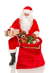 Santa handing out gifts isolated