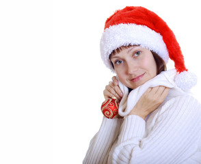 The girl in the hat of Santa Claus with holiday gifts