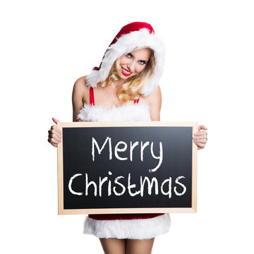 junge blonde Weihnachtsfrau mit Kreidetafel