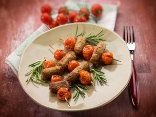 skewer with sausage and cherry tomatoes, selective focus