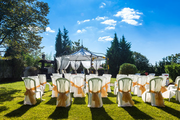 decorated chairs on a outdoor wedding