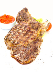 grilling steak with tomato sauce