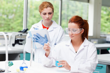 Young science students doing an experiment