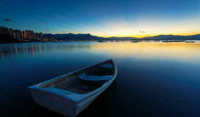 Naklejka na ściany i meble sunset on the lake, boat