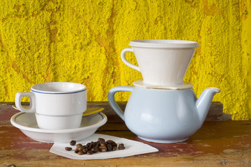 Vintage coffee filter, coffee pot and  cup, coffee beans