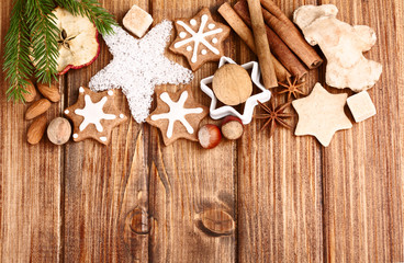 Homemade christmas cookies and spice  on wooden background