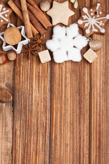 Homemade christmas cookies and spice  on wooden background