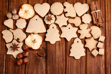 Homemade christmas cookies and spice  on wooden background