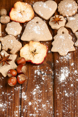 Homemade christmas cookies and spice  on wooden background