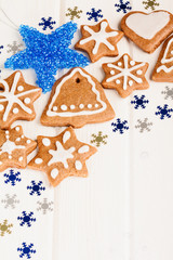 Christmas homemade gingerbread cookies and blue decoration over