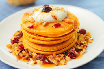 Pumpkin pancakes with walnuts and cranberries