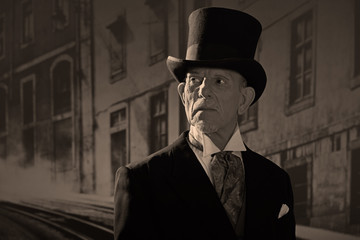 1900 style man wearing black hat and coat. Medicine man in Dicke - obrazy, fototapety, plakaty