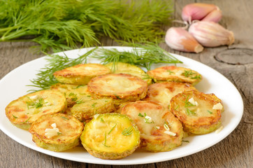 Fried zucchini with dill